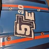 Orange and white versions on the stock body hood panel.