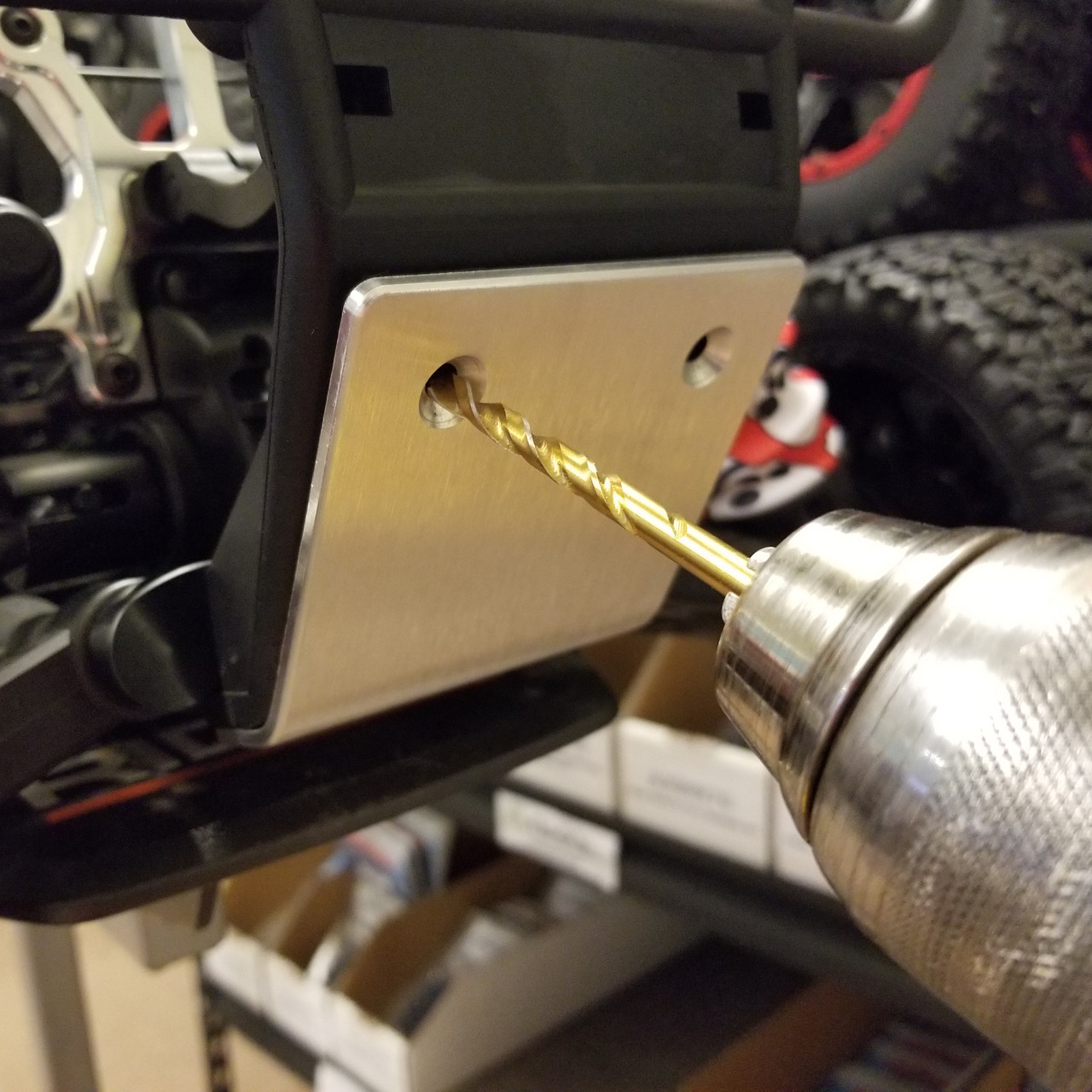 You will need to drill two holes in the plastic bumper for the install.  