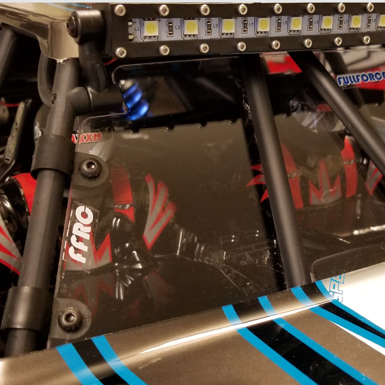 Team Losi Desert Buggy XL-E front windshield (window) mounted the stock truck.
