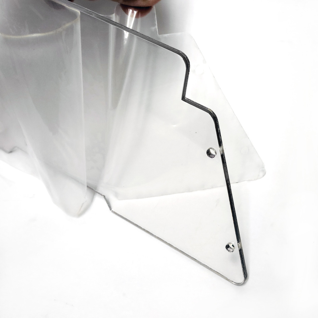 Plastic protective film on both sides of the PETG windshield.  Remove for a crystal clear windshield.