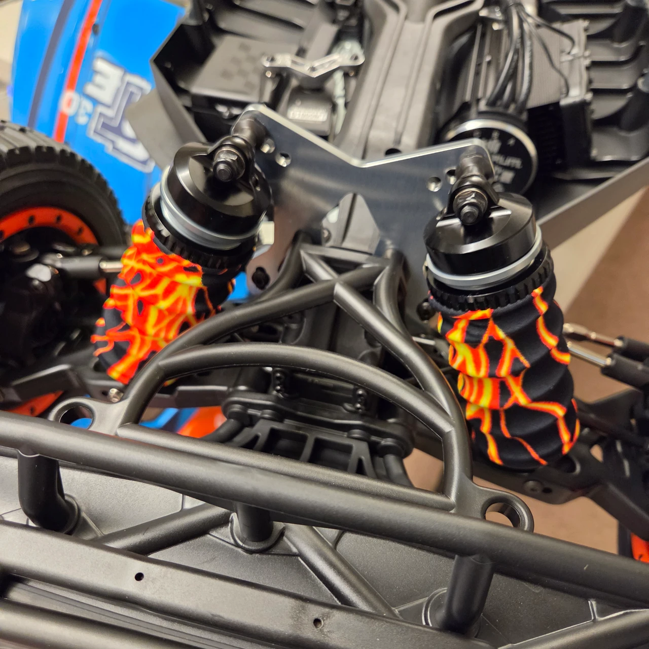 Lightning Orange shock boots installed on our shop 5ive-TE 3.0 truck. These things are HUGE!  Really shows off the lightning patterns on these shock covers.