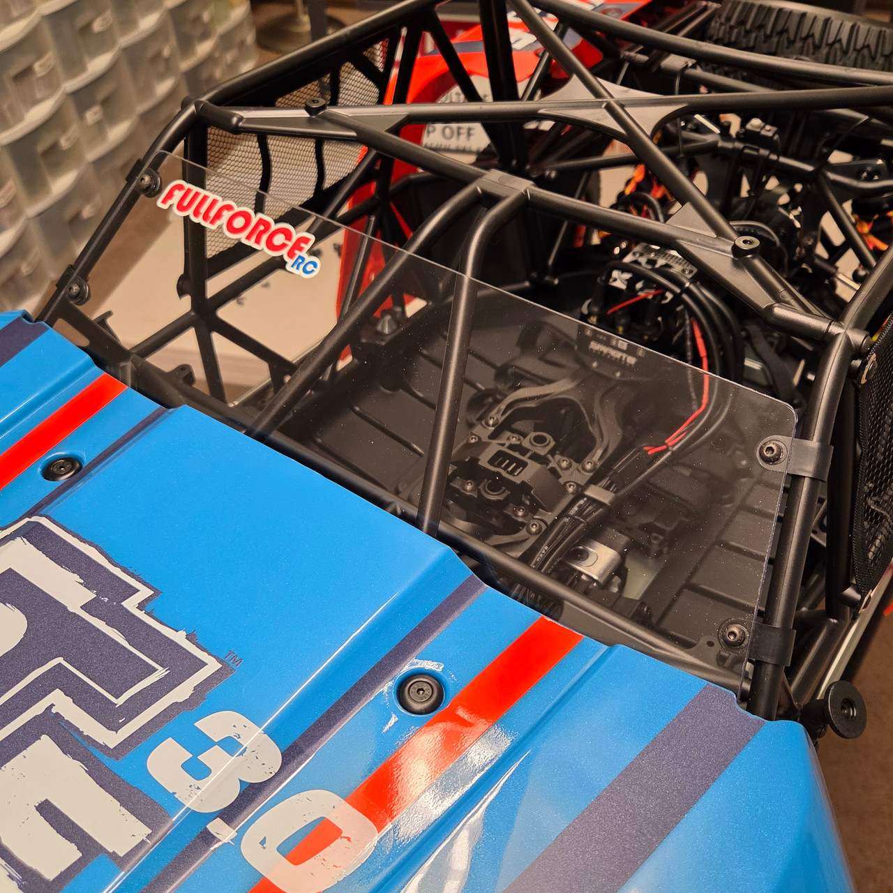 Easiest installation is to remove the two side and the top panel.  Windshields attaches with the supplied clamps and hardware.