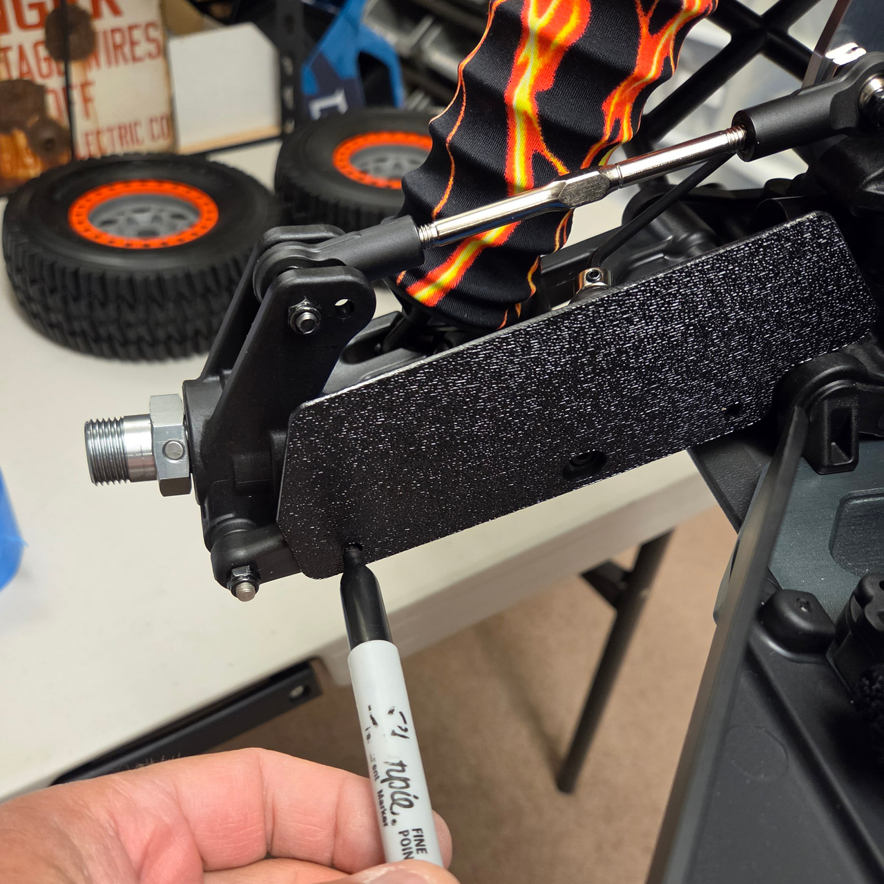 Mark the hole positions on the A-arms making sure you have full clearance and nothing will bind.