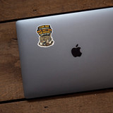 Dark humor sticker with rope duct tape and shovel quote placed on modern laptop lid