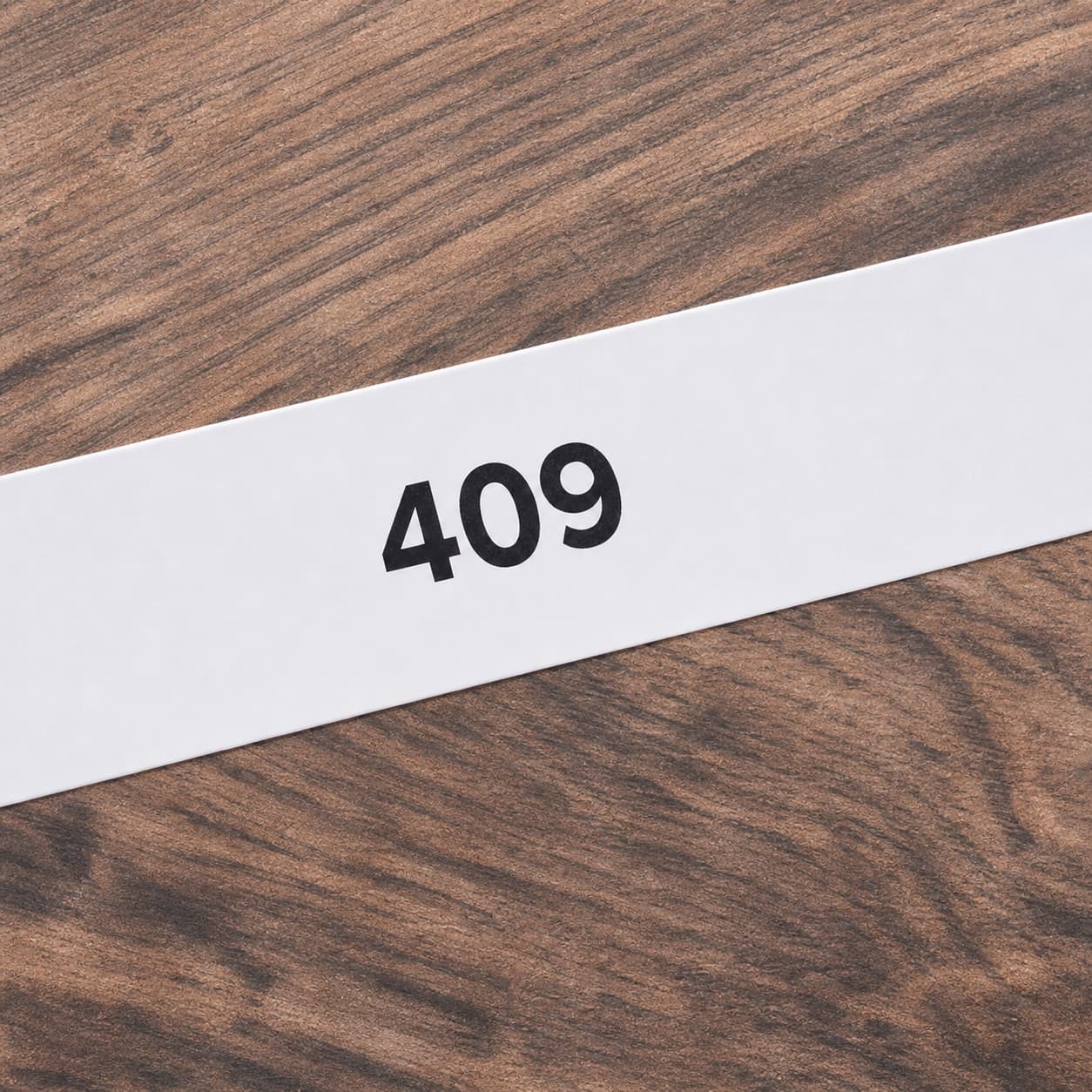 Product code 409 printed on a wood film sample