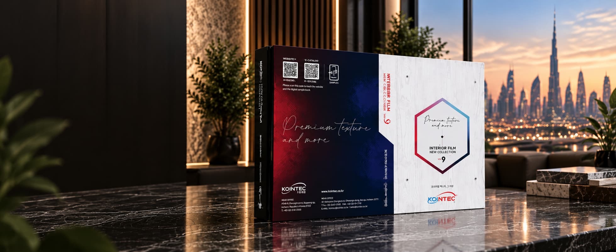 KOINTEC interior film swatch book on a marble counter with the Dubai skyline behind