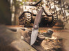 BOKER SOLINGEN 110662DAM M4 SHERMAN DAMAST. 3.03" PLAIN EDGE DAMASCUS BLADE. MICARTA SCALE W/TITANIUM FRAME LOCK HANDLE. BEAUTY SHOT W/TANK. CUTLERY SHOPPE
