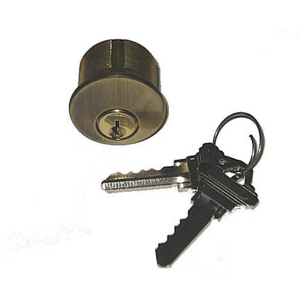 Ilco 7165SC2-05 1" mortise cylinder shown with 2 keys in antique brass finish.