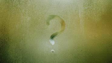 Question mark in steam on glass