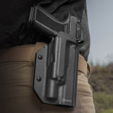 The pass-through belt loops of this holster have locking mechanisms that can be adjusted or removed to work with belts up to 2-1/4".