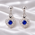 925 Sterling Silver Blue Crystal Heart Dangle Earrings with CZ Accents