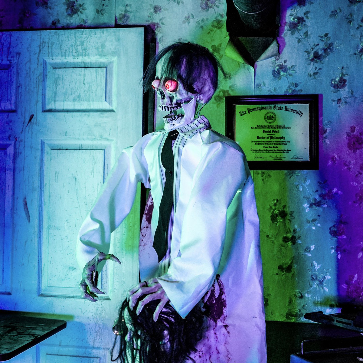 5.6-Ft. Standing Animated Zombie with Bloody Knife & Decapitated