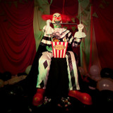 4.1-Ft. Sitting Scareclown with Saw & Candy Animatronic