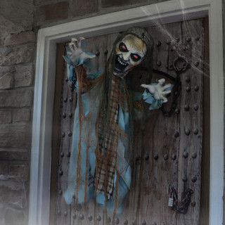 Haunted Hill Farm Dungeon Dave the Animatronic Twisting Zombie in Chains with Backdrop and Folding Door Hook for Scary Halloween Decoration