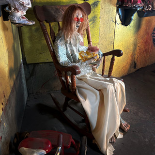 3.8-Ft. Sitting Animated Creepy Woman Holding Doll Animatronic