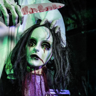 5.6-Ft. Standing Animated Zombie with Bloody Knife & Decapitated Head Animatronic
