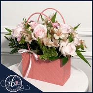Elegance in Bloom: Our Pink Purse Flower Arrangement 