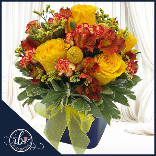 A flower arrangement Featuring vibrant yellow roses paired with delicate red and yellow alstroemeria and carnations, this bouquet radiates energy and joy. Crafted by Ritzy Blooms in Fort Lauderdale