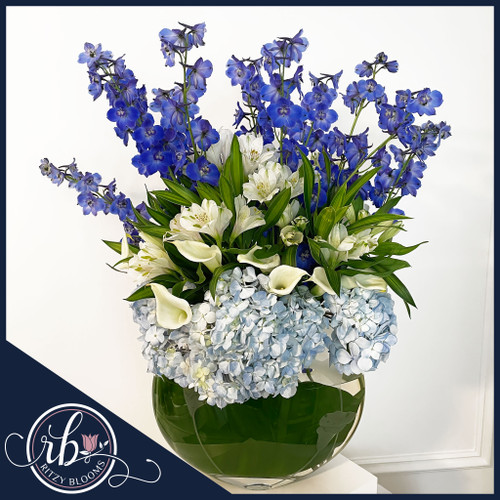 Ocean Breeze floral arrangement with blue hydrangeas and calla lilies in a Clear Moon Bowl Vase – Fort Lauderdale florist