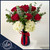 12 red roses and white hydrangeas arrangement in a deep blue vase with greenery and satin ribbon, available for same-day delivery in Fort Lauderdale.