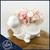 Petite blush preserved flower arrangement in a white ceramic turtle vase, handcrafted by a Fort Lauderdale florist for bedroom and nursery decor.