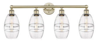 Edison Four Light Bath Vanity in Antique Brass (405|6164WABG5576CL)