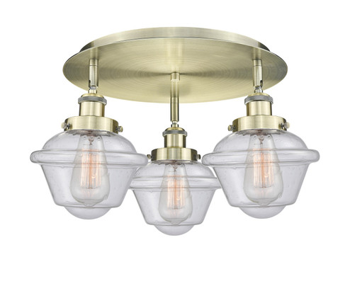 Downtown Urban Three Light Flush Mount in Antique Brass (405|9163CABG534)