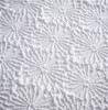 Set of four luxury embossed floral cushions featuring an elegant textured pattern, concealed zip fastening, and stylish design for sofas and living rooms. material view.