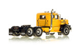 1:50 scale model of a 1954 Autocar DC-100T Tandem Axle Integral Sleeper - Yellow over Black