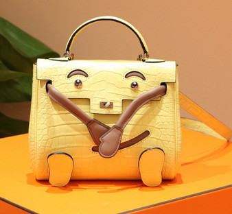 Hermes Kelly Idole (Kelly Doll) in C9 Soupre Yellow Porosus Crocodile with palladium hardware. Hermes Kelly Idole (Kelly Doll) in C9 Soupre Yellow Porosus Crocodile with palladium hardware.