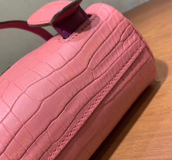 Hermes Kelly Idole (Kelly Doll) in Pink Sakura  Nilo crocodile with Palladium hardware. Hermes Kelly Idole (Kelly Doll) in Pink Sakura  Nilo crocodile with Palladium hardware.