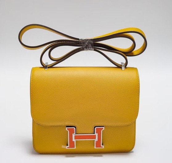Hermes Jaune d'or Constance Epsom leather 18cm With Enamel Hardware