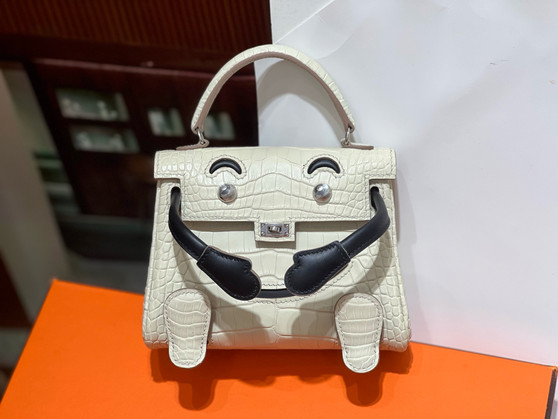 Hermes Kelly Idole (Kelly Doll) in Craie Nilo crocodile with Palladium hardware.