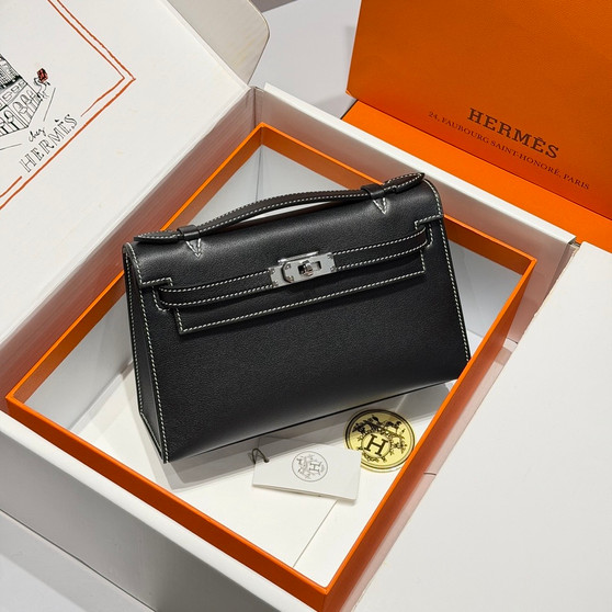 Hermès Mini Kelly II 20 Sellier bag in black Madamn leather with white contrast stitching and palladium hardware