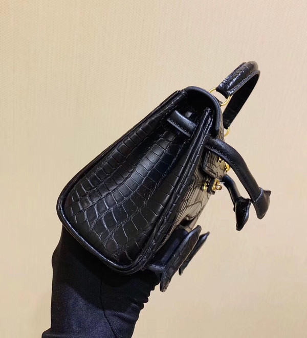 Hermes Kelly Idole (Kelly Doll) in Black Alligator with Gold hardware.