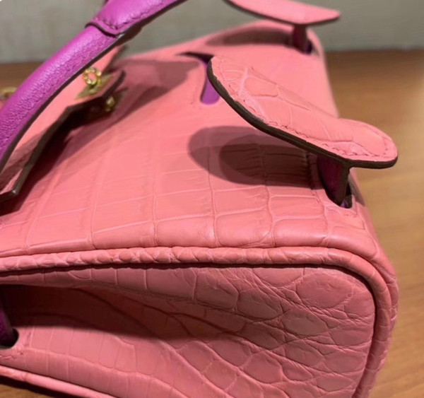 Hermes Kelly Idole (Kelly Doll) in Pink Sakura  Nilo crocodile with Palladium hardware.