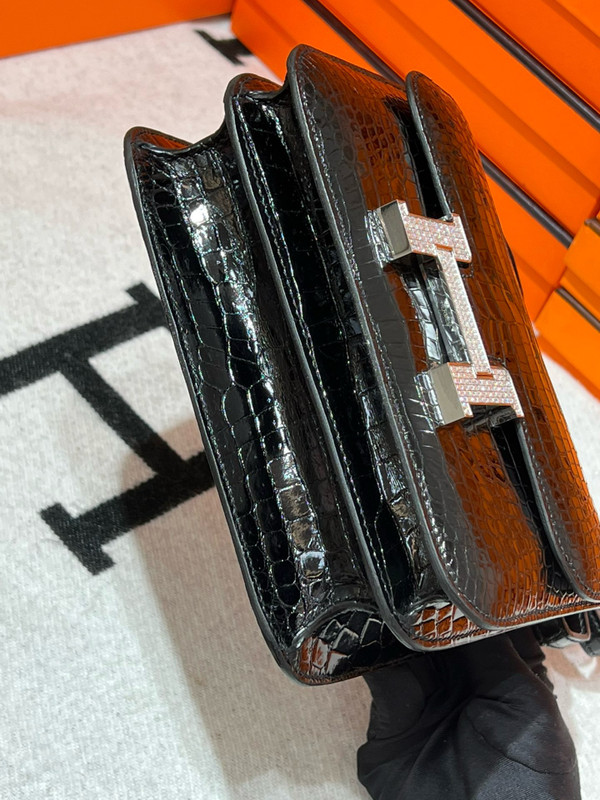 HERMES SHINY BLACK POROSUS CROCODILE MINI CONSTANCE 18 WITH 18K WHITE GOLD & DIAMOND HARDWARE