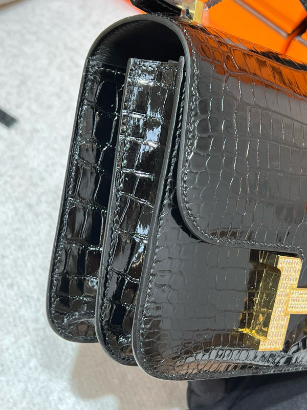 HERMES SHINY BLACK POROSUS CROCODILE MINI CONSTANCE 18 WITH GOLD & DIAMOND HARDWARE
