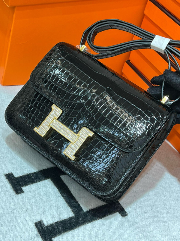 HERMES SHINY BLACK POROSUS CROCODILE MINI CONSTANCE 18 WITH GOLD & DIAMOND HARDWARE