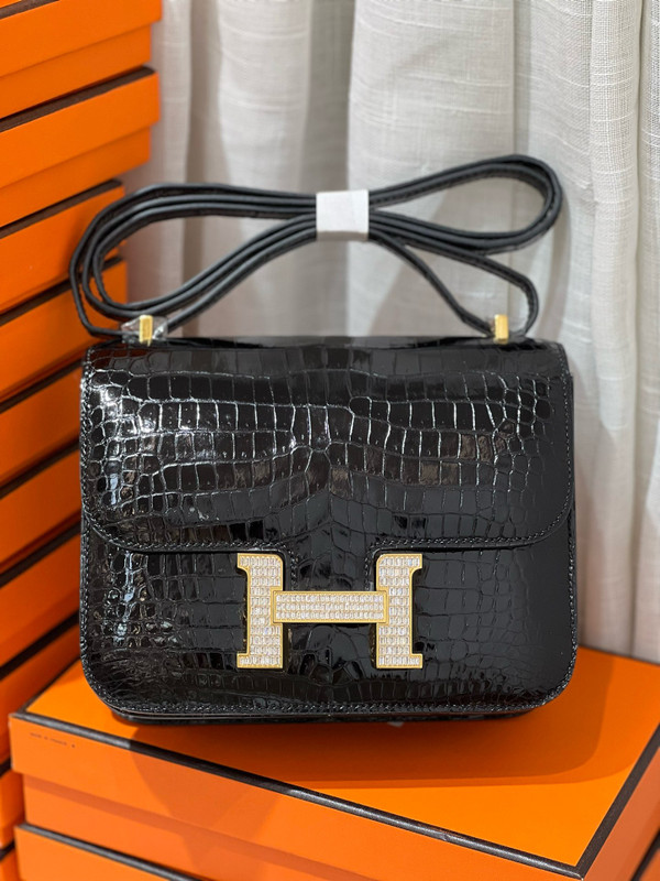 HERMES SHINY BLACK POROSUS CROCODILE MINI CONSTANCE 18 WITH GOLD & DIAMOND HARDWARE