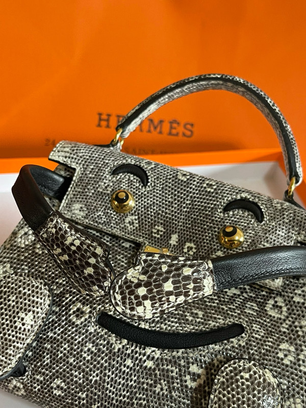 Hermes Kelly Idole (Kelly Doll) in Lizard with Gold hardware.