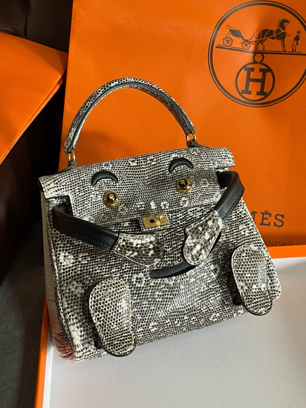Hermes Kelly Idole (Kelly Doll) in Lizard with Gold hardware.