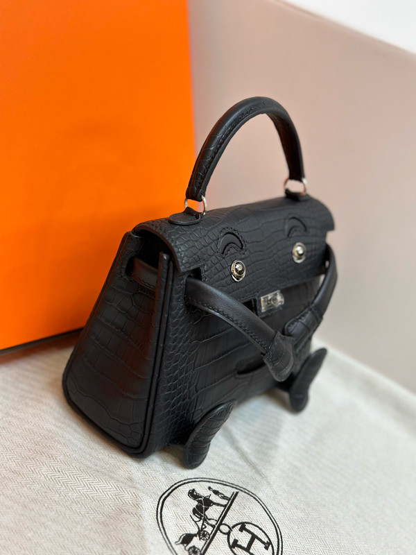 Hermes Kelly Idole (Kelly Doll) in Black Alligator with Palladium hardware.
