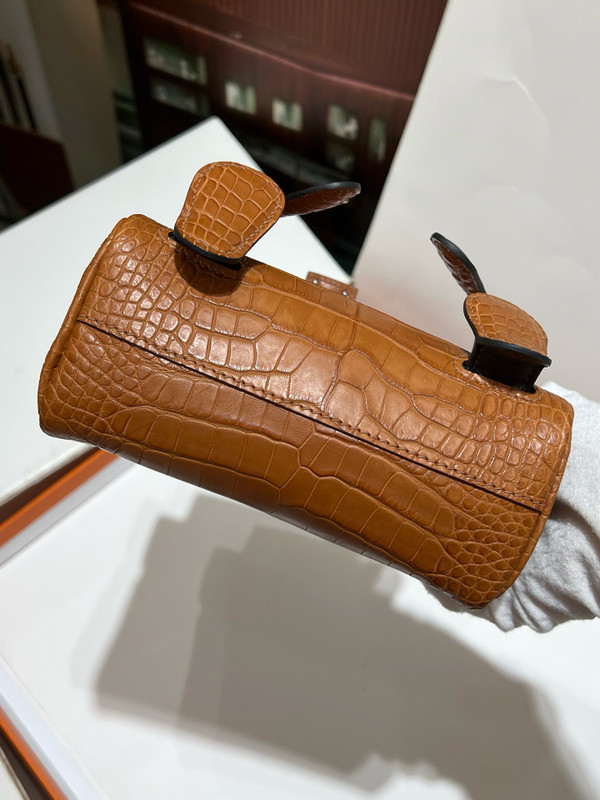 Hermes Kelly Idole (Kelly Doll) in Gold Nilo crocodile with Palladium hardware.