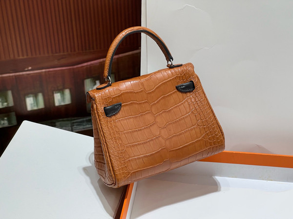Hermes Kelly Idole (Kelly Doll) in Gold Nilo crocodile with Palladium hardware.