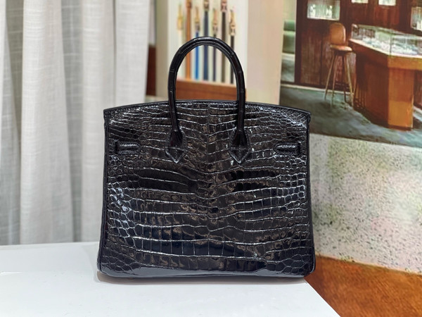 HERMES SHINY BLACK POROSUS CROCODILE DIAMOND BIRKIN 25 WITH 18K WHITE DIAMOND HARDWARE