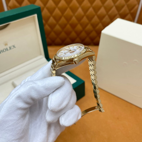 ROLEX DAY-DATE 36 18k Yellow Gold | White Mother-of-Pearl Baguette Dial | President Bracelet