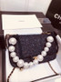 Chanel Pearl flap bag in black tweed