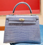 Hermes SHINY BLUE BRIGHTON NILOTICUS CROCODILE KELLY 25 WITH GOLD HARDWARE  Hermes SHINY BLUE BRIGHTON NILOTICUS CROCODILE KELLY 25 WITH GOLD HARDWARE