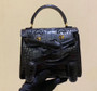 Hermes Kelly Idole (Kelly Doll) in Black Alligator with Gold hardware. Hermes Kelly Idole (Kelly Doll) in Black Alligator with Gold hardware.